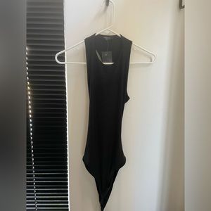 Bodysuit from Nastygal. Size 6. Never been worn. Has open back.